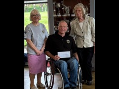 Trustee, Bruce & Gilly collect the cheque donation